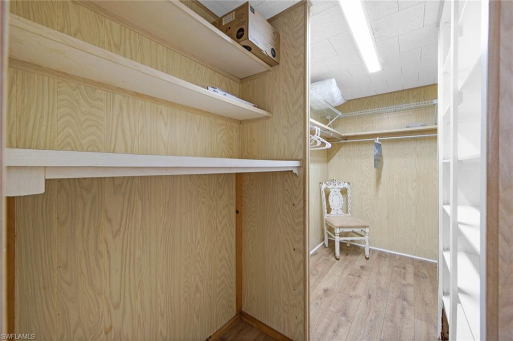 28 Enchanting Boulevard, Unit E28 Naples, FL 34112 - Photo 17 of 28 a view of walk in closet with empty racks