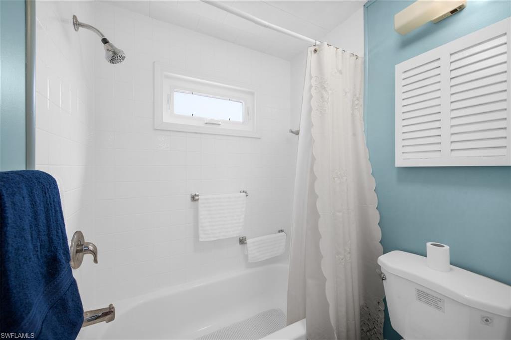 28 Enchanting Boulevard, Unit E28 Naples, FL 34112 - Photo 20 of 28 a white toilet sitting next to a bath tub