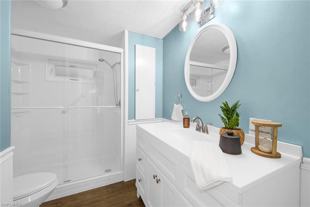28 Enchanting Boulevard, Unit E28 Naples, FL 34112 - Photo 21 of 28 a bathroom with a sink a toilet and shower