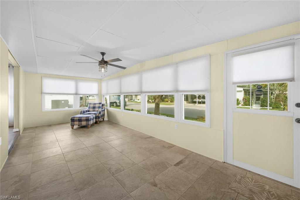 28 Enchanting Boulevard, Unit E28 Naples, FL 34112 - Photo 23 of 28 a view of a livingroom with furniture and a window