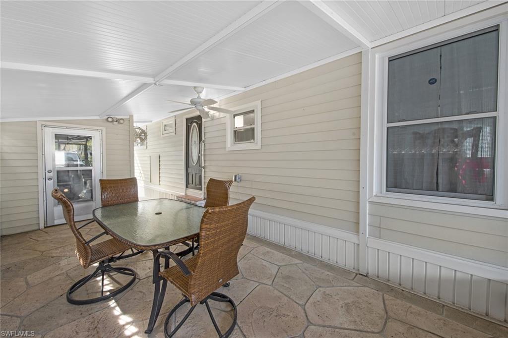 28 Enchanting Boulevard, Unit E28 Naples, FL 34112 - Photo 25 of 28 a view of a table and chairs in a room