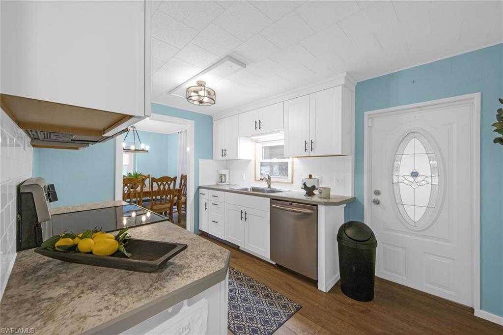 28 Enchanting Boulevard, Unit E28 Naples, FL 34112 - Photo 5 of 28 a kitchen with stainless steel appliances granite countertop a sink dishwasher stove and refrigerator