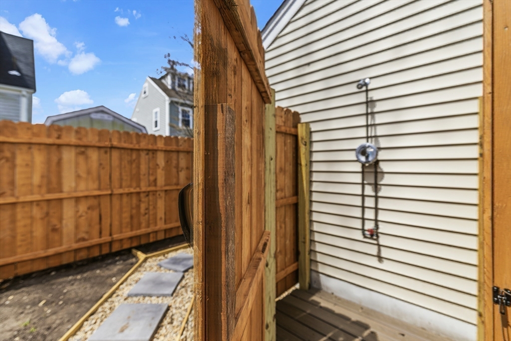 8 Cottage Street Wareham, MA 02571 - Photo 24 of 30 a view of a street with a garage