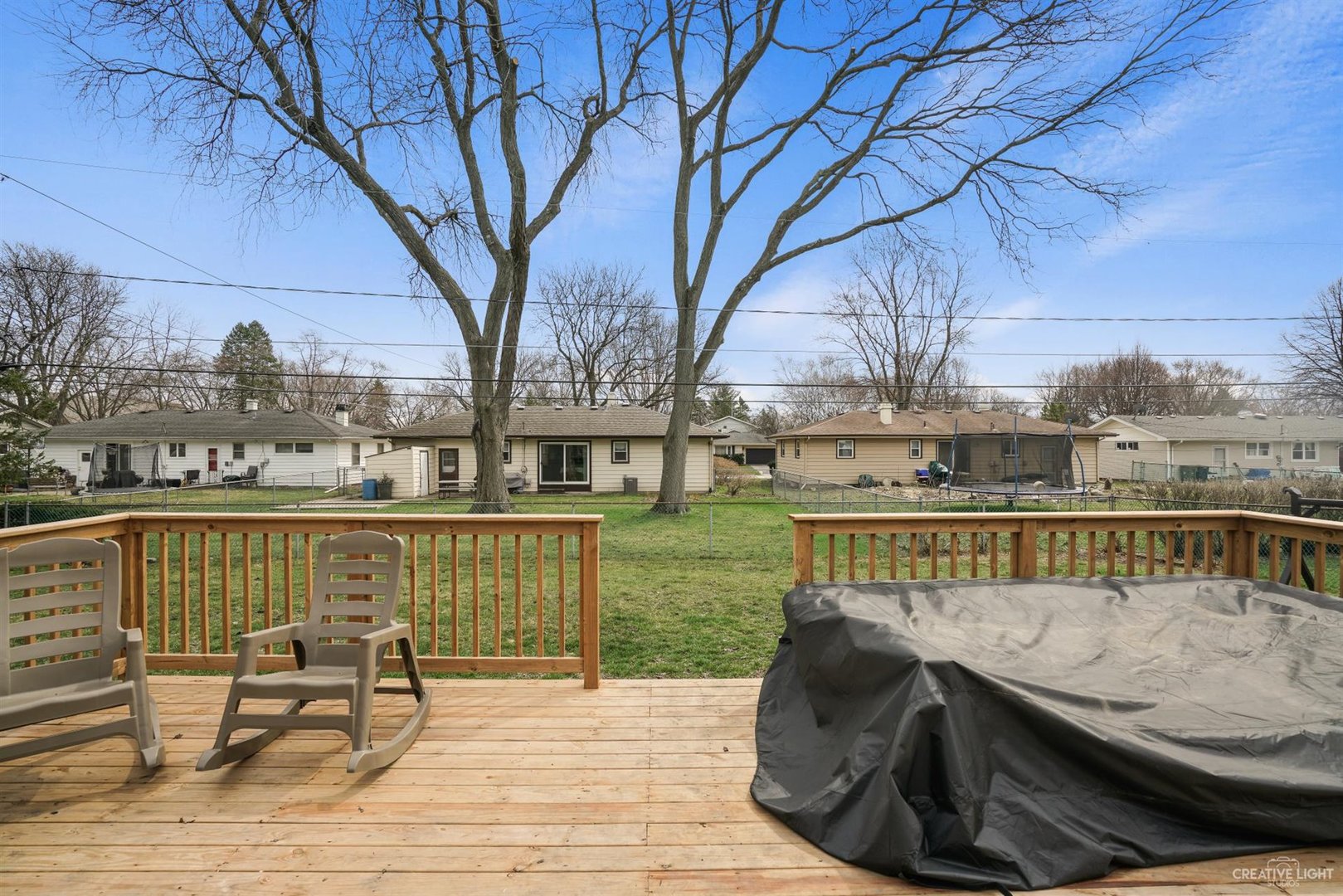 987 Ruth Drive Elgin, IL 60123 - Photo 22 of 25 a view of a lake with couches chairs and wooden floor