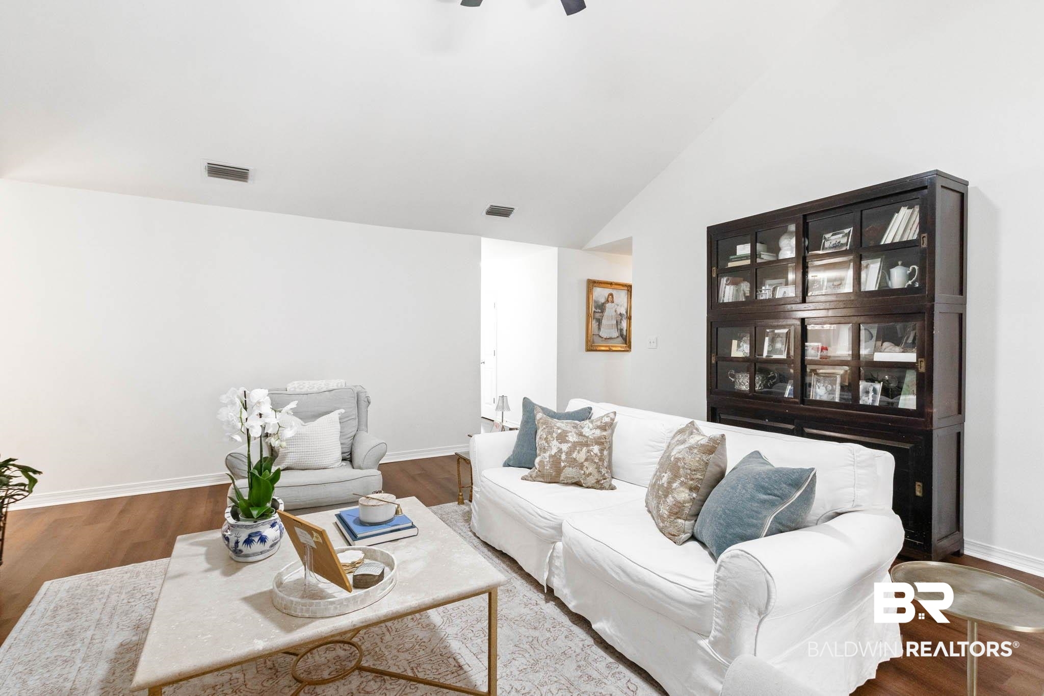 20685 Lowry Drive Fairhope, AL 36532 - Photo 14 of 48 Living room with wood finished floors, lofted ceiling, and ceiling fan