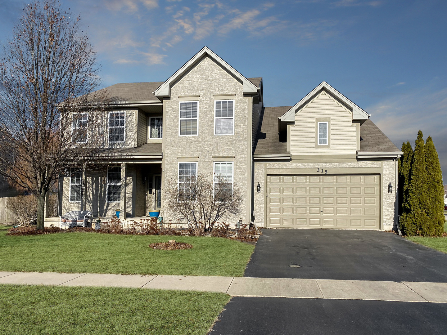 215 Wilkins Road Sycamore, IL 60178 - Photo 1 of 28 a front view of a house with a yard