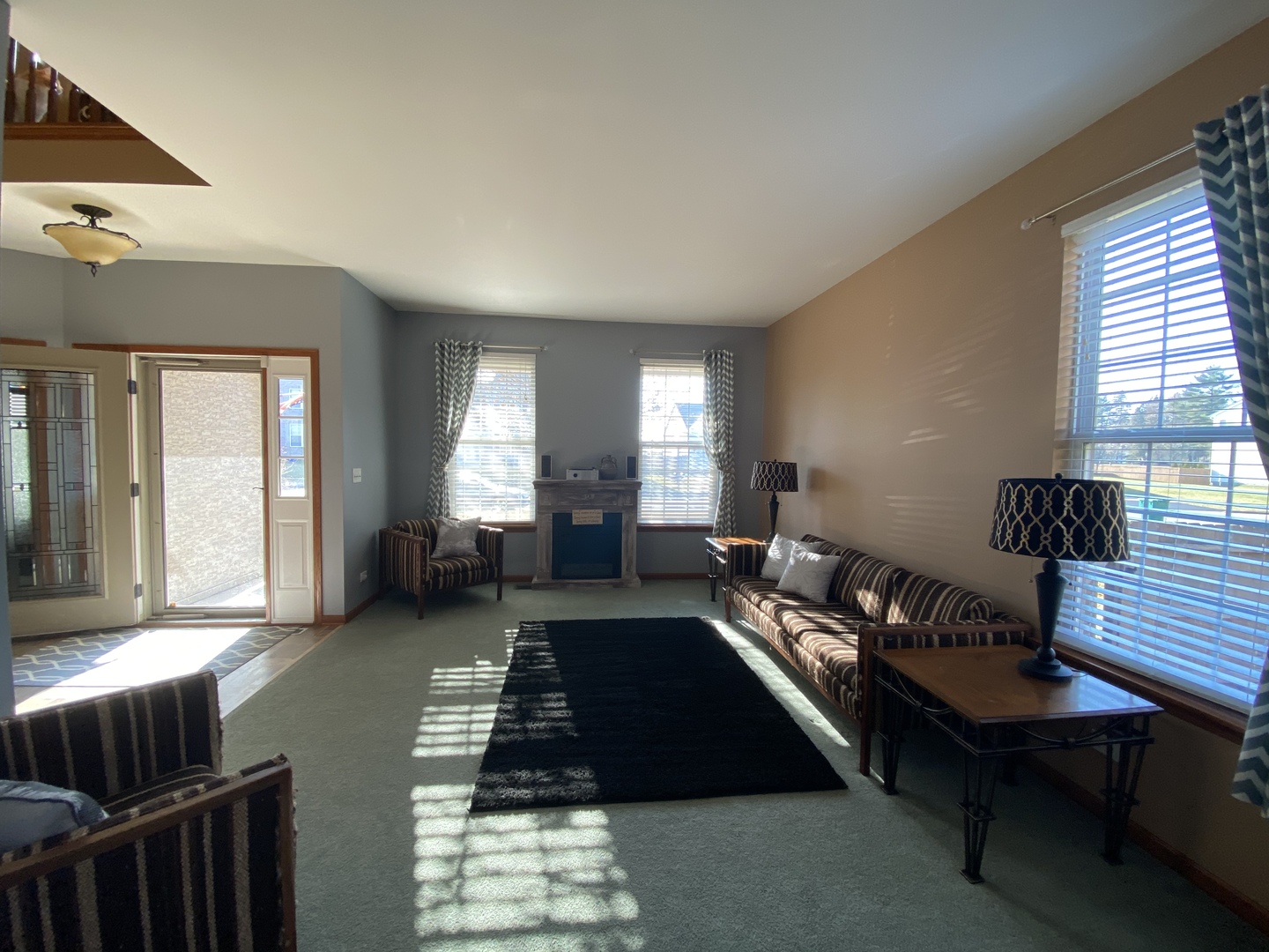 215 Wilkins Road Sycamore, IL 60178 - Photo 13 of 28 a living room with furniture lamp and windows