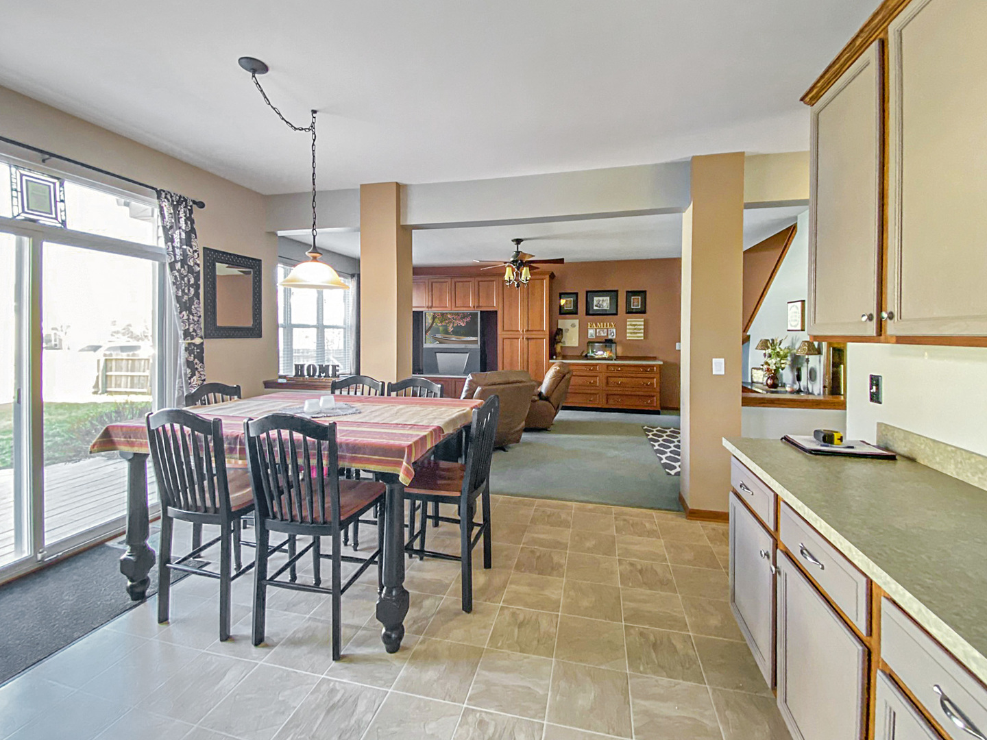 215 Wilkins Road Sycamore, IL 60178 - Photo 4 of 28 a kitchen with a table chairs and a wooden floor