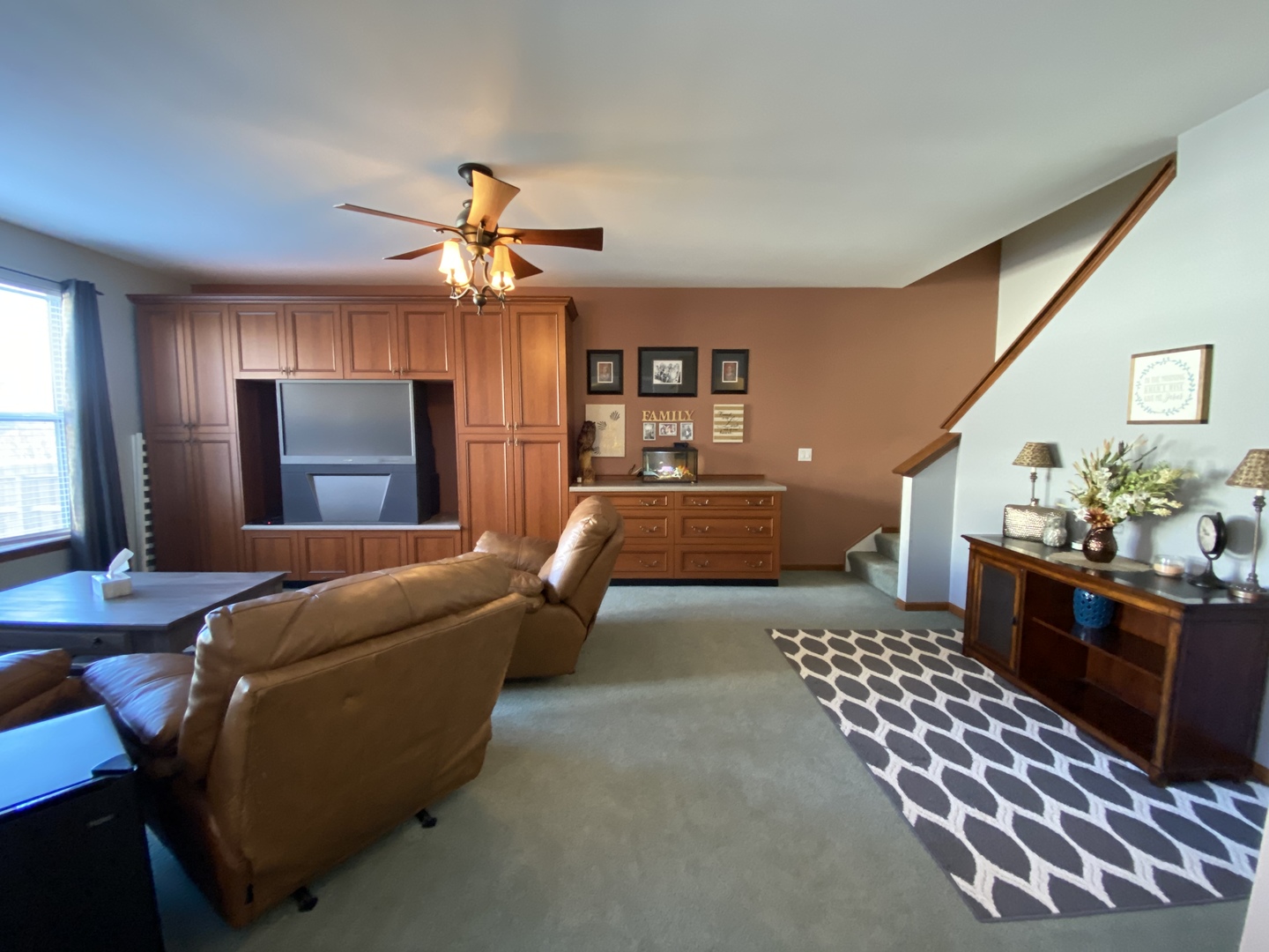 215 Wilkins Road Sycamore, IL 60178 - Photo 8 of 28 a living room with furniture and a chandelier