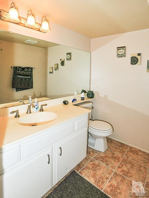 3636 Olds Road Oxnard, CA 93033 - Photo 14 of 23 a bathroom with a sink a toilet and mirror