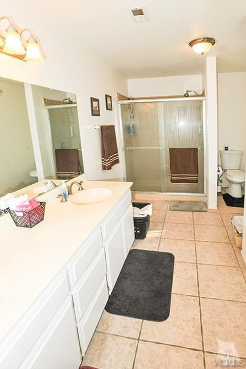 3636 Olds Road Oxnard, CA 93033 - Photo 22 of 23 a bathroom with a sink a toilet and shower