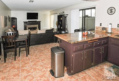 3636 Olds Road Oxnard, CA 93033 - Photo 7 of 23 a kitchen with granite countertop a sink cabinets and stainless steel appliances