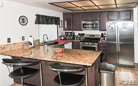 3636 Olds Road Oxnard, CA 93033 - Photo 9 of 23 a kitchen with stainless steel appliances granite countertop a sink stove and refrigerator