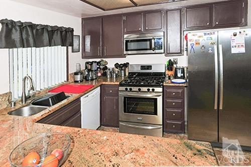 3636 Olds Road Oxnard, CA 93033 - Photo 10 of 23 a kitchen with a stove sink and refrigerator