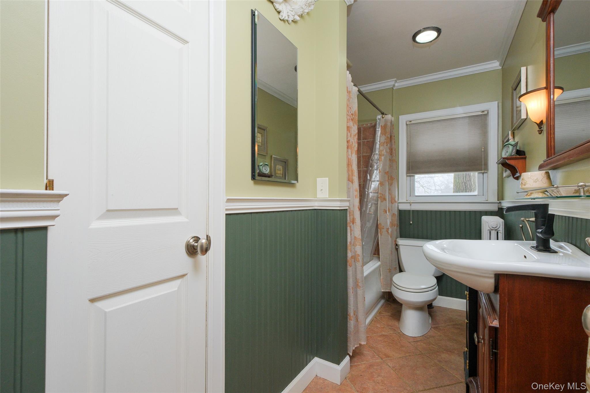 1611 Hyatt Avenue Peekskill, NY 10566 - Photo 14 of 25 a bathroom with a sink a toilet and shower