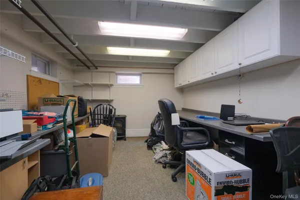 a view of a workspace with furniture