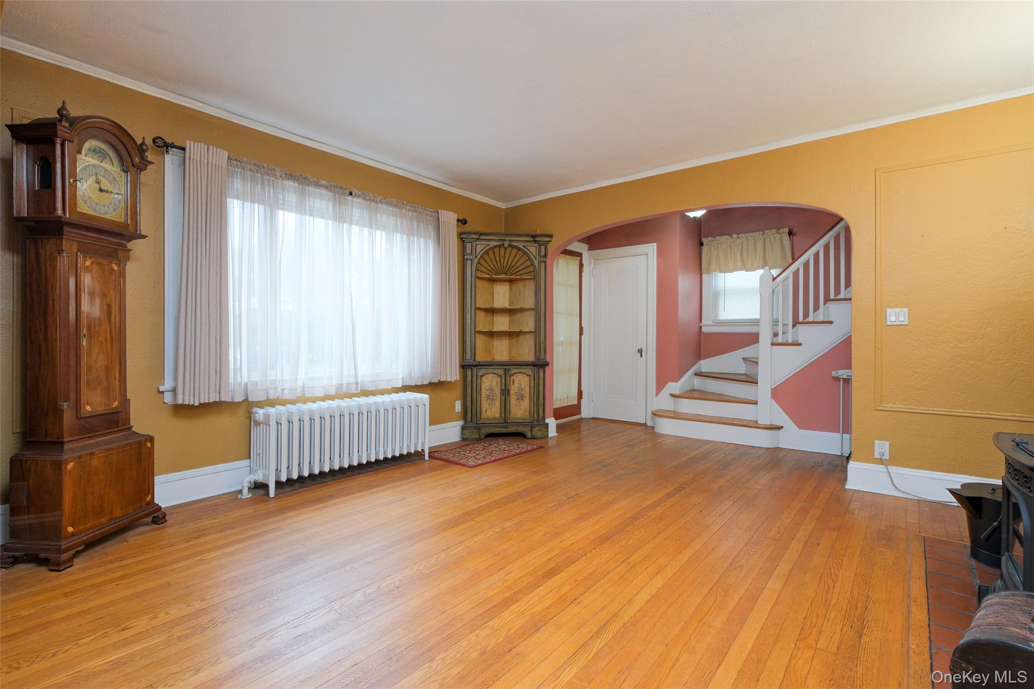 1611 Hyatt Avenue Peekskill, NY 10566 - Photo 2 of 25 a view of an empty room with stairs and a window