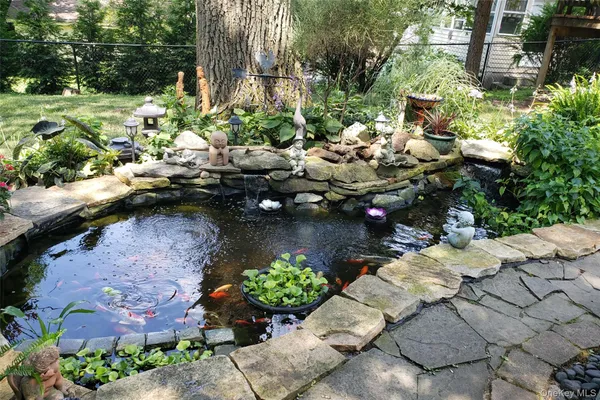 a view of swimming pool with a table and chairs