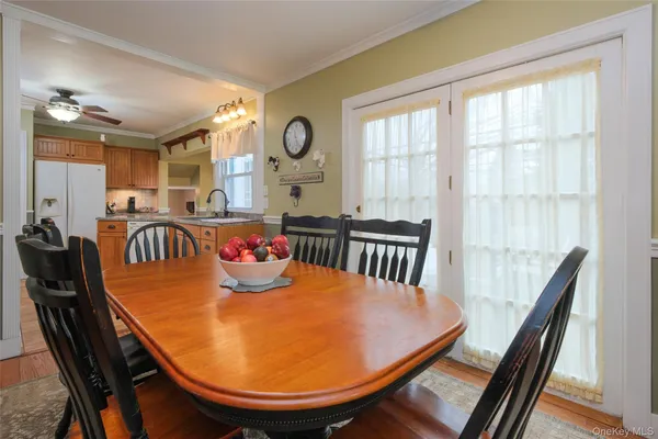 a view of a dining room with furniture and window