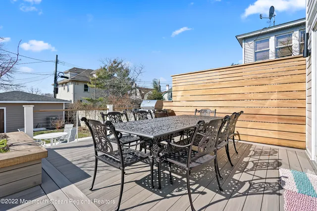 a view of a patio with table and chairs and potted plants
