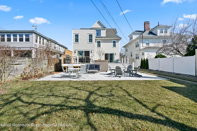 a view of a swimming pool with outdoor seating