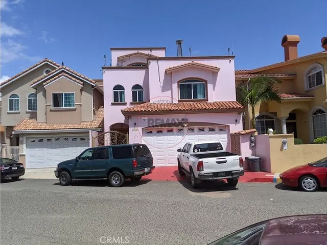 a view of a car parked in front of a house