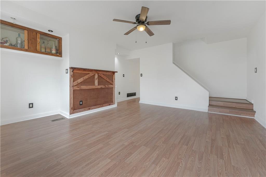 534 Magazine Street Carnegie, PA 15106 - Photo 2 of 11 wooden floor in an empty room with a window