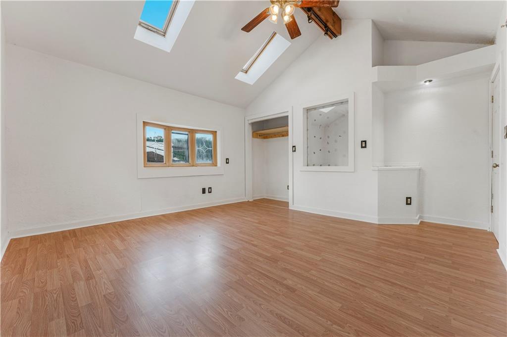 534 Magazine Street Carnegie, PA 15106 - Photo 6 of 11 a view of an empty room with wooden floor and a window