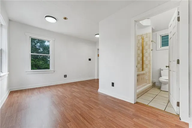 a view of an empty room and glass door