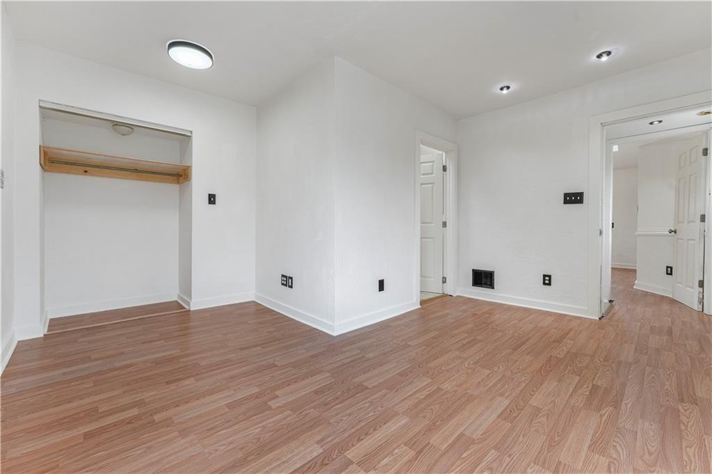 534 Magazine Street Carnegie, PA 15106 - Photo 8 of 11 a view of an empty room with wooden floor and a window