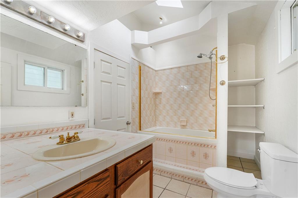 534 Magazine Street Carnegie, PA 15106 - Photo 9 of 11 a bathroom with a granite countertop sink toilet and shower