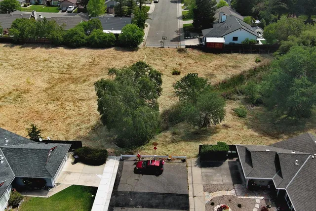 an aerial view of a house with outdoor space