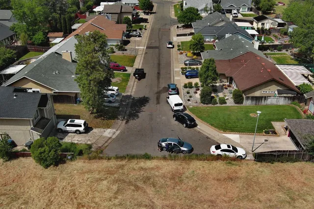 an aerial view of residential houses with outdoor space
