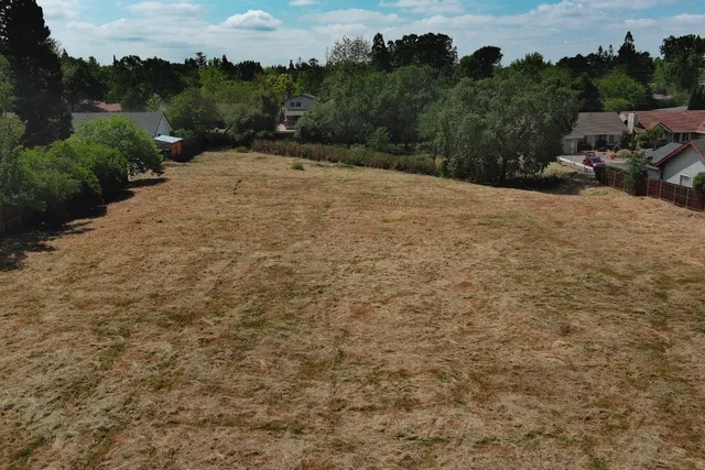aerial view of a house with a yard