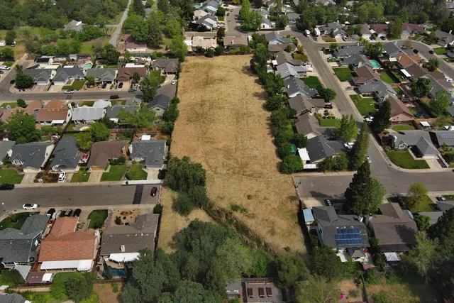 an aerial view of a city with lots of residential buildings