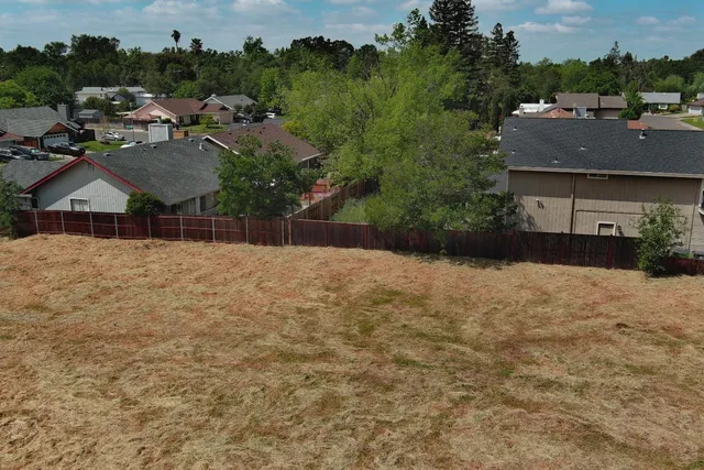 a backyard of a house with lots of green space