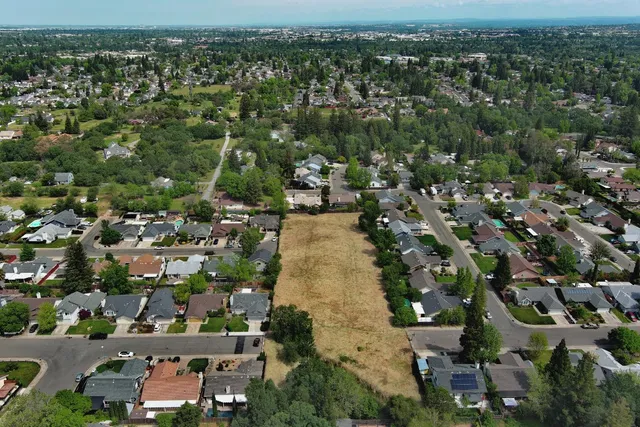 an aerial view of a city with lots of residential buildings