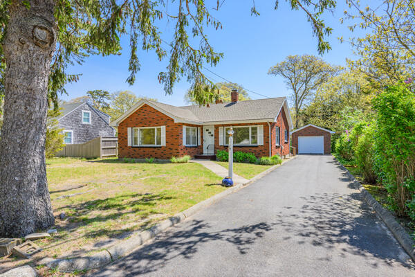 129 Belmont Road West Harwich, MA 02671 - Photo 2 of 27 a front view of a house with swimming pool