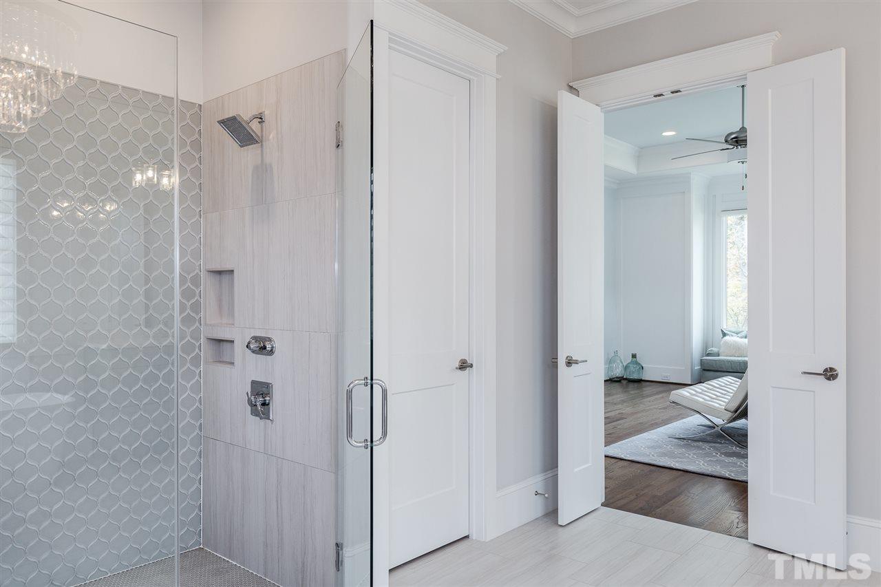 5417 Winding View Lane Raleigh, NC 27615 - Photo 16 of 30 Large tiled shower with dual shower heads, dual walk-in closets, and plenty of sunlight.