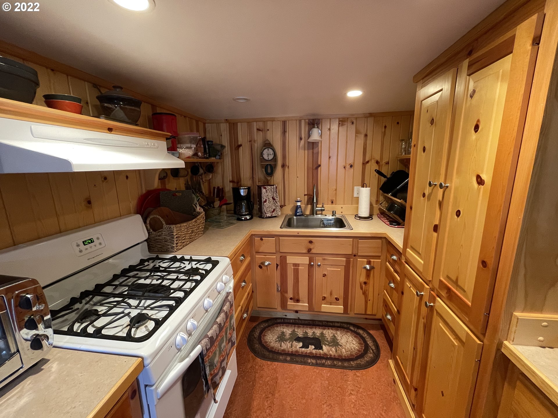 81 Soda Springs Road Goldendale, WA 98620 - Photo 11 of 31 a kitchen with a sink stove and cabinets
