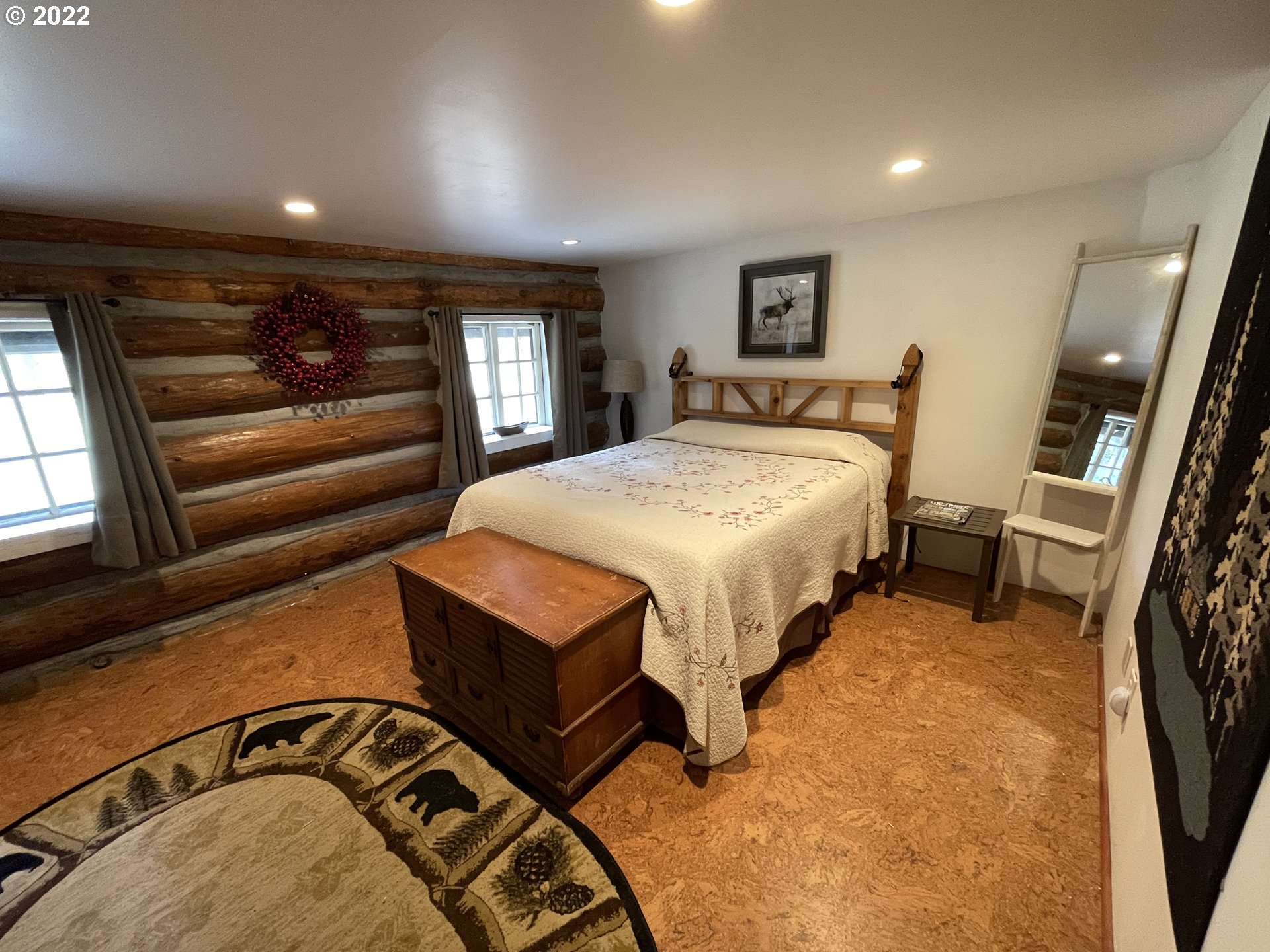 81 Soda Springs Road Goldendale, WA 98620 - Photo 15 of 31 a spacious bedroom with a bed a couch and dresser