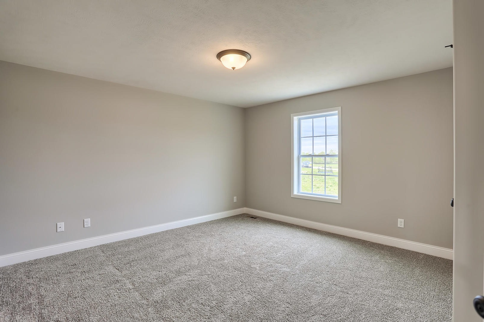 303 Collins Drive Mahomet, IL 61853 - Photo 23 of 32 an empty room with a window