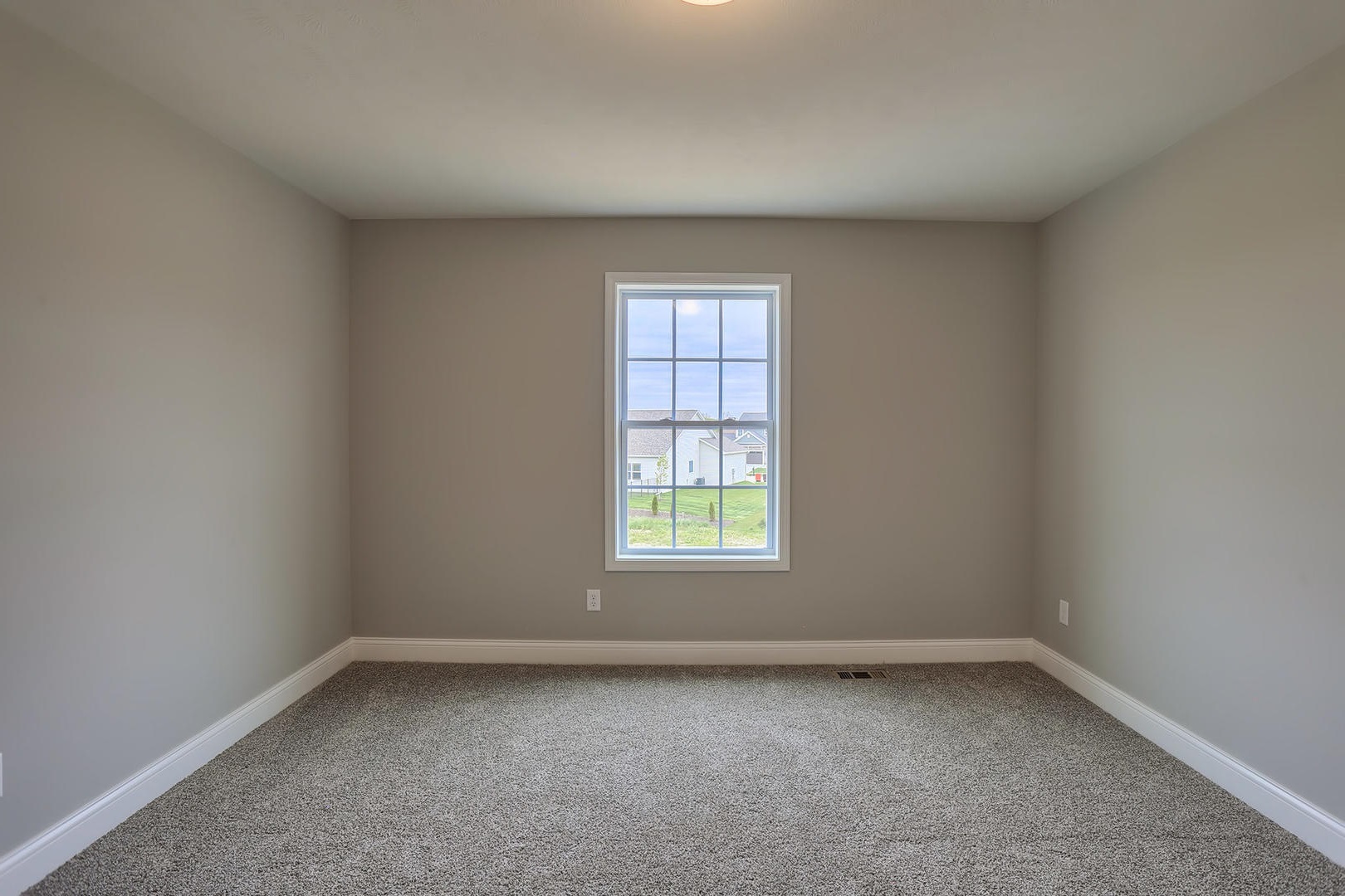 303 Collins Drive Mahomet, IL 61853 - Photo 27 of 32 an empty room with a window