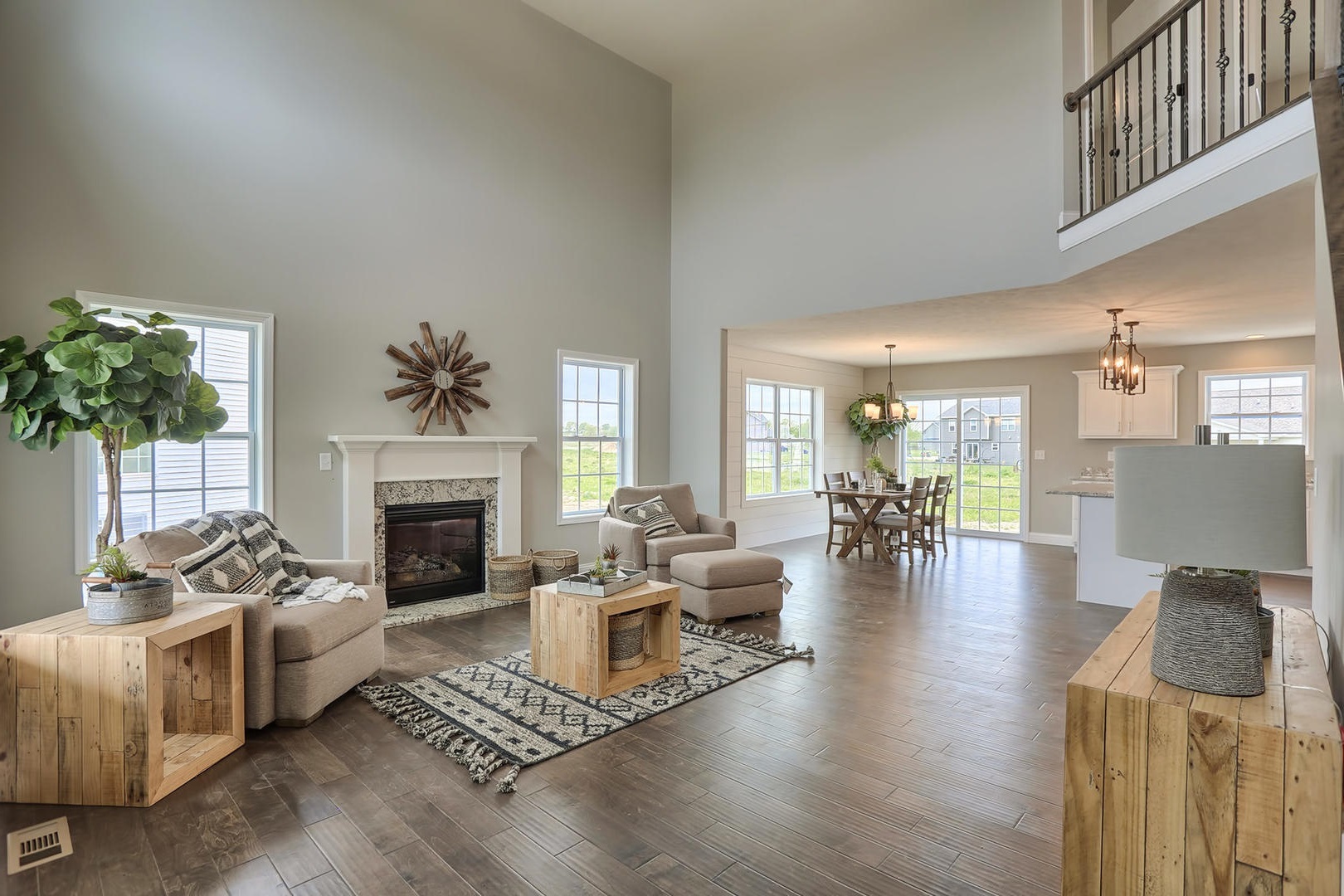 303 Collins Drive Mahomet, IL 61853 - Photo 3 of 32 a living room with furniture fireplace and potted plant