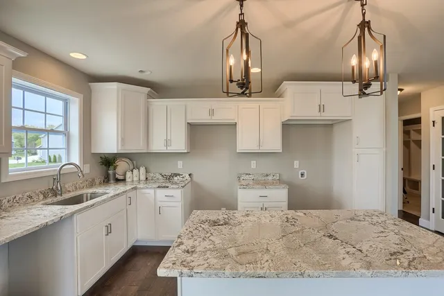 a kitchen with a sink stove and refrigerator