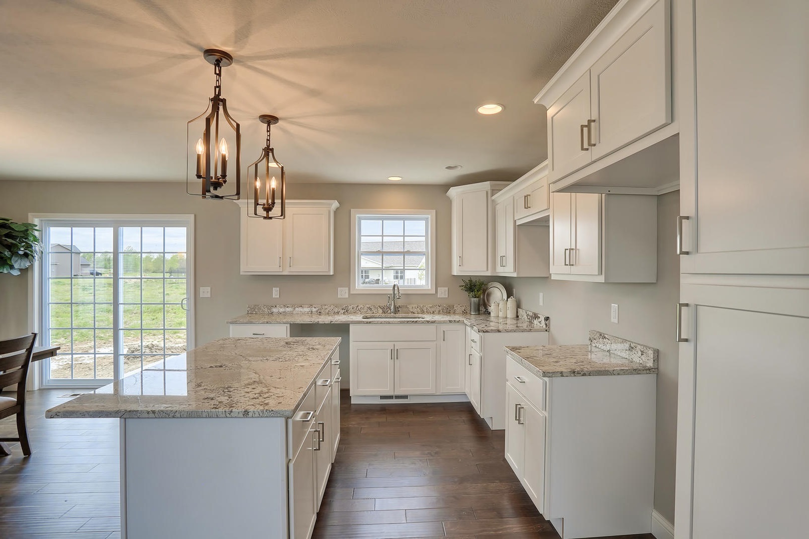 303 Collins Drive Mahomet, IL 61853 - Photo 9 of 32 a kitchen with a sink stove and cabinets