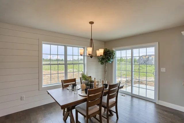 a dining room with furniture window wooden floor