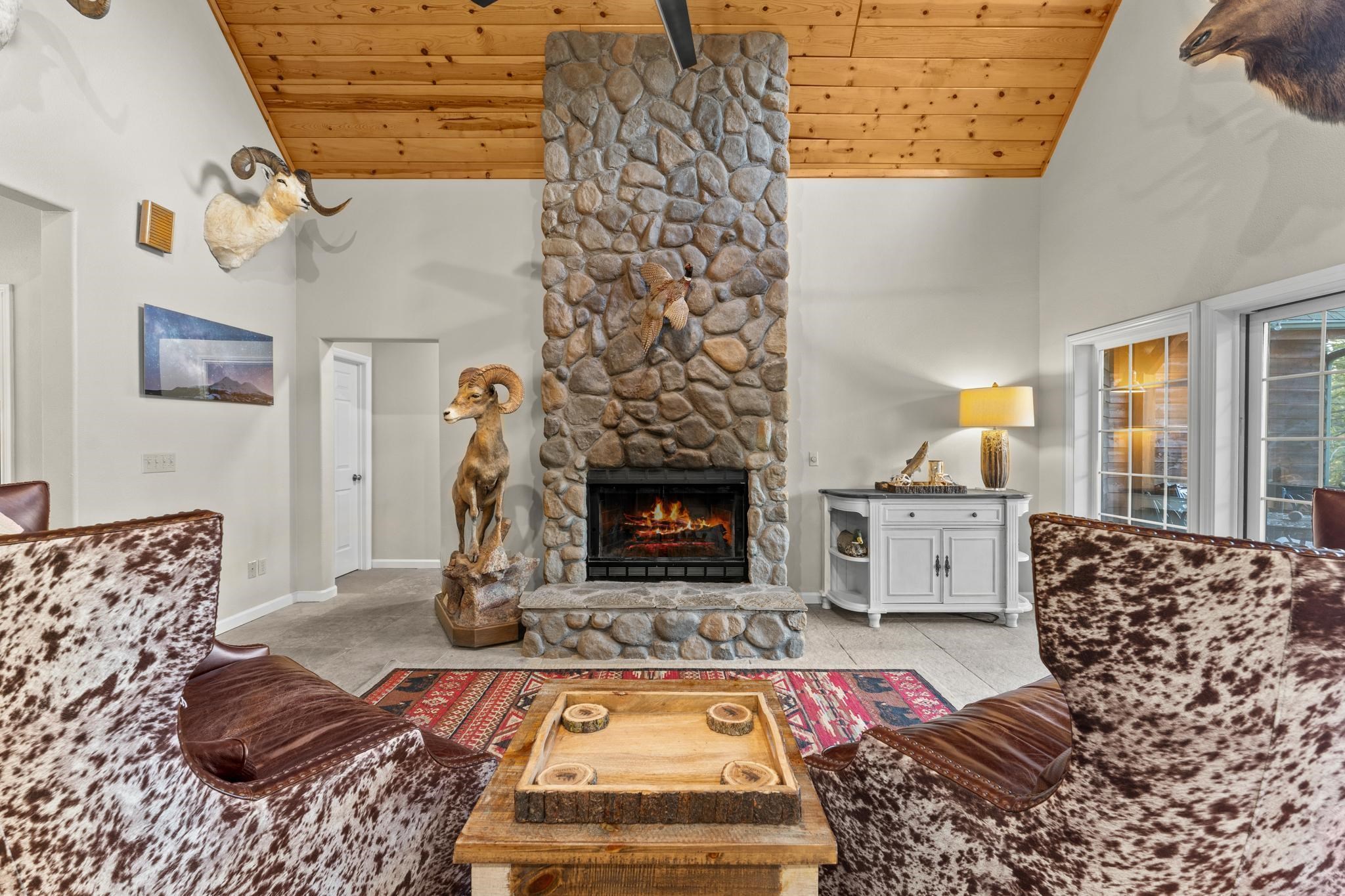 1341 Valley Ranch Drive Clio, CA 96106 - Photo 8 of 50 a living room with furniture and a fireplace