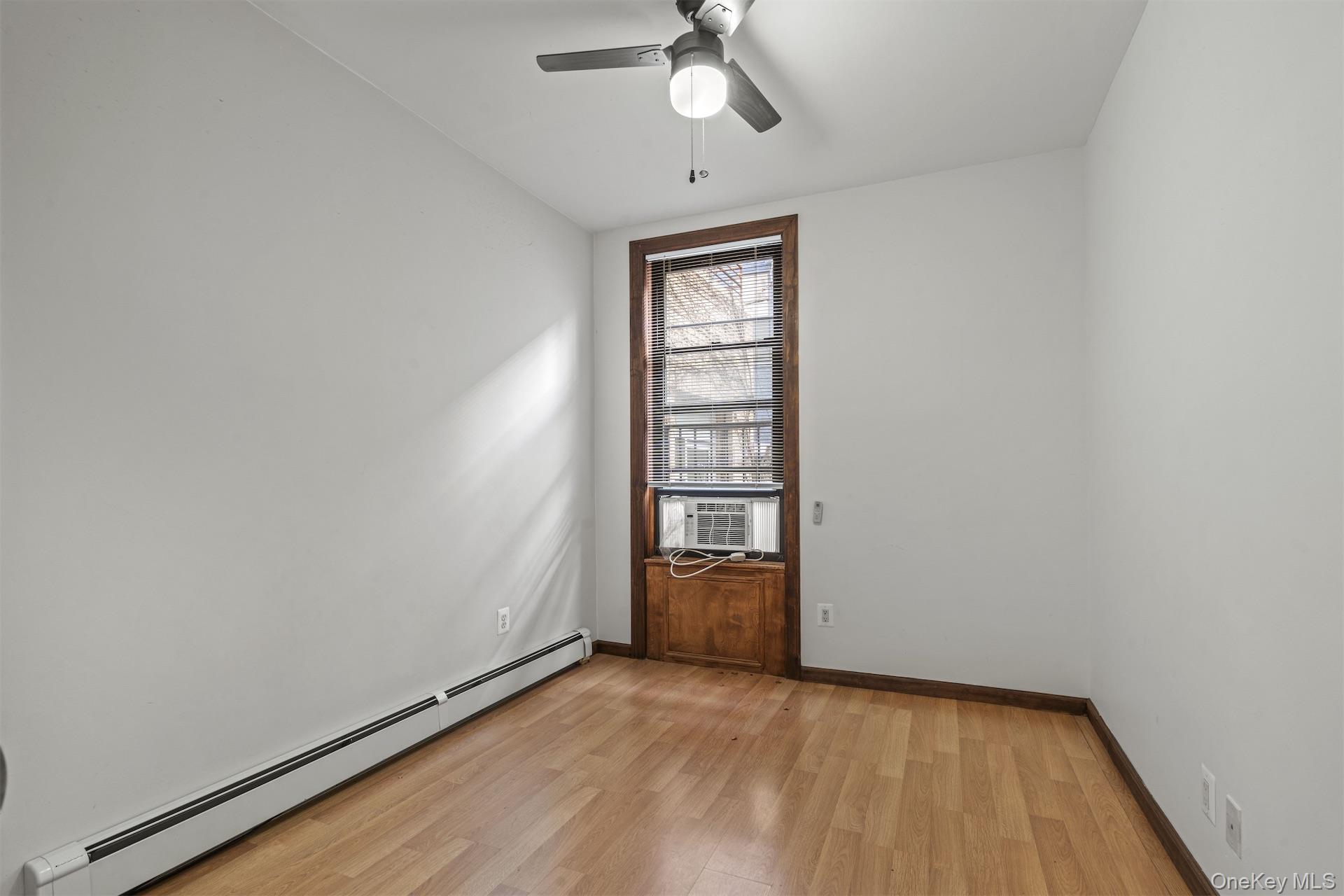 44 Decatur Street, Unit 2 Brooklyn, NY 11216 - Photo 5 of 8 an empty room with closet and windows