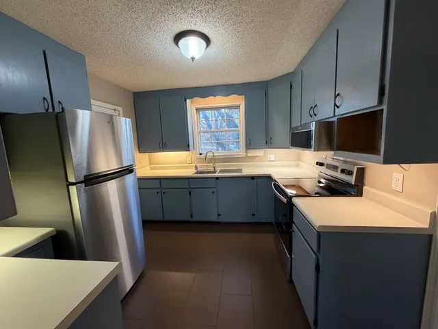 an empty room with a empty space and windows